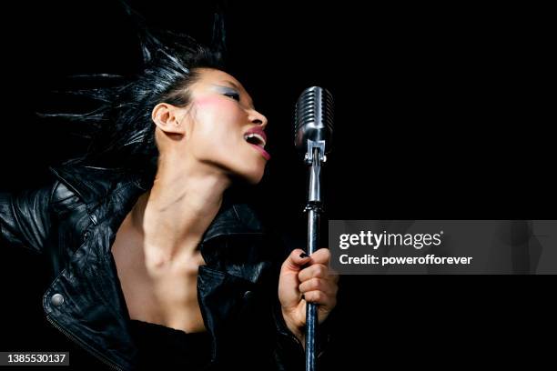 woman punk rock singer - mohawk stock pictures, royalty-free photos & images