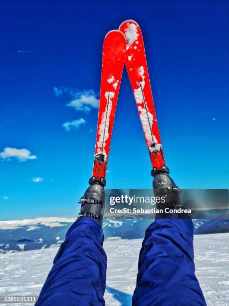 skis, moment of skiing, in contrast to the blue sky. - alps romania stock pictures, royalty-free photos & images