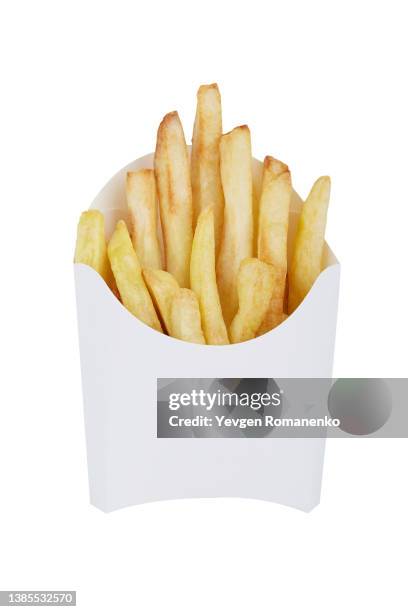 french fries in a white disposable box, isolated on white background - fast food french fries stock-fotos und bilder