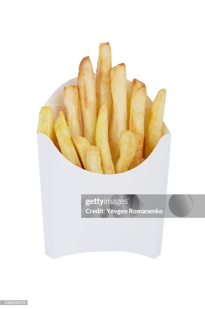 French fries in a white disposable box, isolated on white background