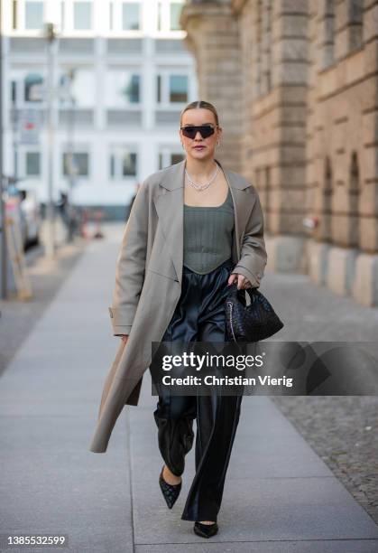 Tina Haase is seen wearing Joseph beige leather coat, H&m corset top, Nakd leather pants, Nunoo bag, Le Specs sunglasses, Zara heels during Berlin...