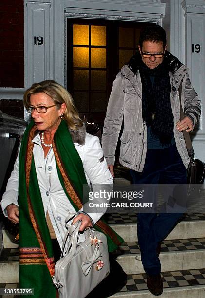 Former England football team manager Fabio Capello and his wife Laura leaves their central London home on February 9 a day after he resigned from his...