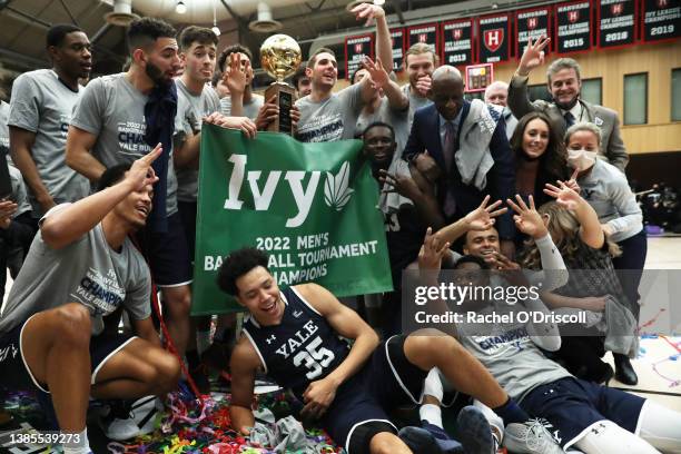 The Yale Bulldogs with the Ivy League Basketball Tournament Championship trophy and banner after defeating the Princeton Tigers in the finals at...