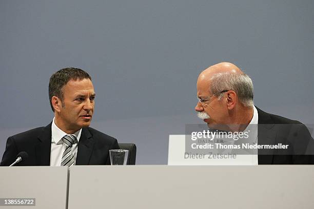 Of Daimler AG, Dieter Zetsche talks to Bodo Uebber during the company's financial performance in 2011 during the Daimler AG, annual press conference...