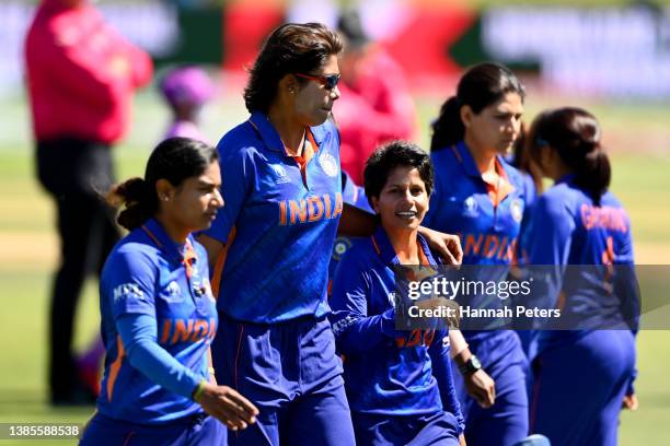 Jhulan Goswami and Poonam Yadav of India walk out for the 2022 ICC Women's Cricket World Cup match between England and India at Bay Oval on March 16,...