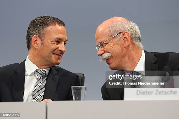 Of Daimler AG, Dieter Zetsche talks to Bodo Uebber during the company's financial performance in 2011 during the Daimler AG, annual press conference...