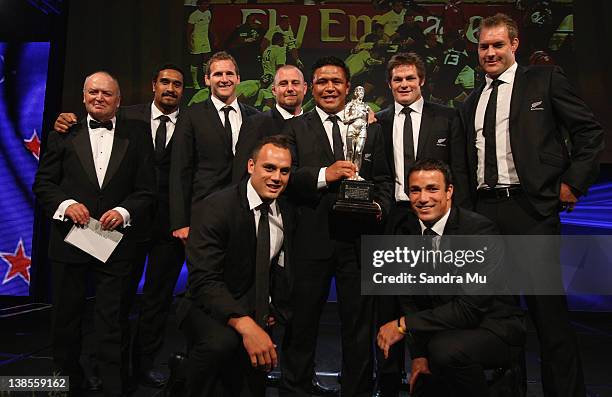 Members of the All Blacks pose on stage with the Supreme Halberg Award during the 2012 Halberg Awards at Sky City Convention Centre on February 9,...