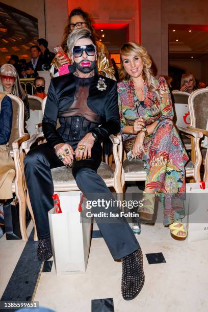 German singer Annemarie Eilfeld and designer Harald Gloeoeckler attend the Anja Gockel Fashion Show Autumn/Winter 2022 during Berlin Fashion Week...