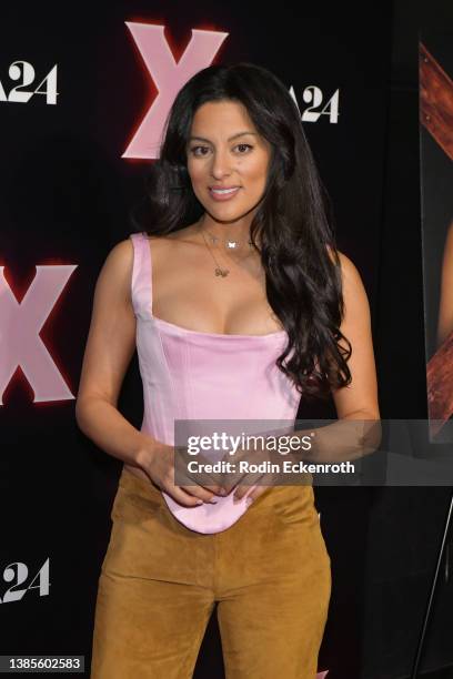 Carmela Zumbado attends a photo call for the Los Angeles premiere of A24's "X" at TCL Chinese 6 Theatres on March 15, 2022 in Los Angeles, California.