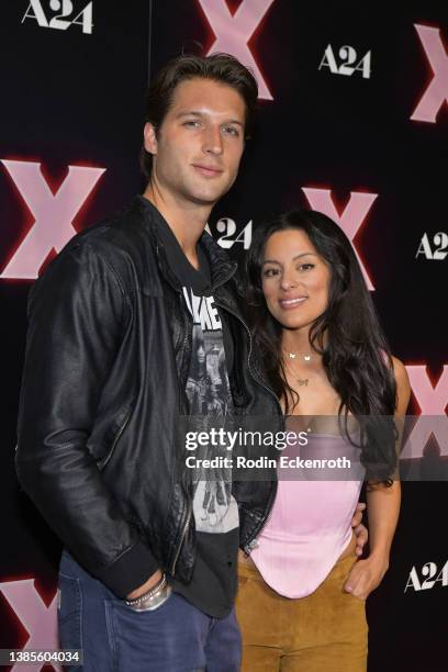 Zak Steiner and Carmela Zumbado attend a photo call for the Los Angeles premiere of A24's "X"at TCL Chinese 6 Theatres on March 15, 2022 in Los...