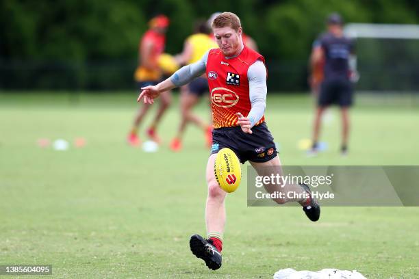 Matt Rowell kicks during a Gold Coast Suns training session at Metricon Stadium on March 16, 2022 in Gold Coast, Australia.