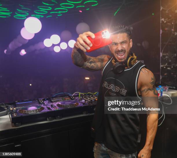 Pauly D poses for a picture during a show as part of the spring break 2022 at The Cave on March 14, 2022 in Cancun, Mexico.