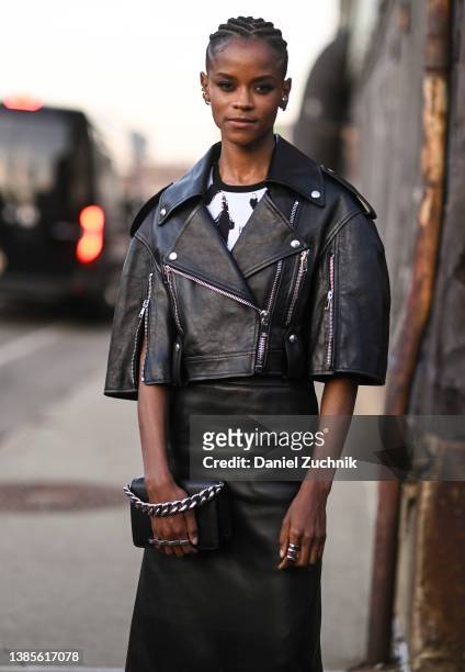 Letitia Wright is seen wearing a black jacket and black leather skirt outside the Alexander McQueen AW22 show on March 15, 2022 in the borough of...