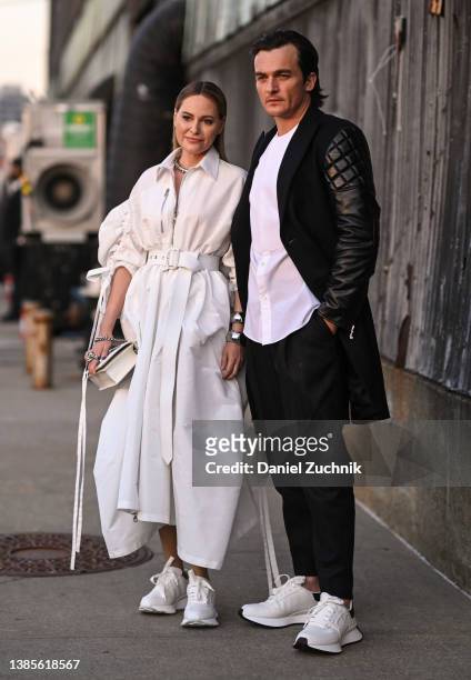 Aimee Mullins and Rupert Friend are seen outside the Alexander McQueen AW22 show on March 15, 2022 in the borough of Brooklyn, New York.