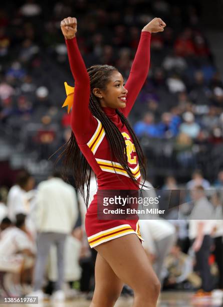 Trojans cheerleader performs during the team's game against the Washington Huskies during the Pac-12 Conference basketball tournament quarterfinals...