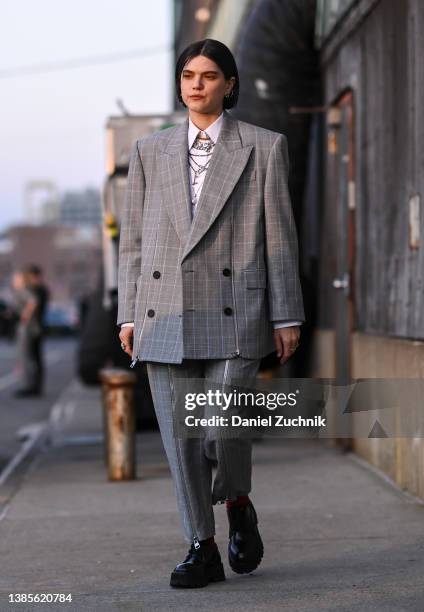 Soko is seen wearing an gray Alexander McQueen suit outside the Alexander McQueen AW22 show on March 15, 2022 in the borough of Brooklyn, New York.