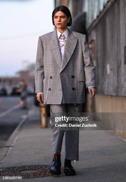 Soko is seen wearing an gray Alexander McQueen suit outside the Alexander McQueen AW22 show on March 15, 2022 in the borough of Brooklyn, New York.