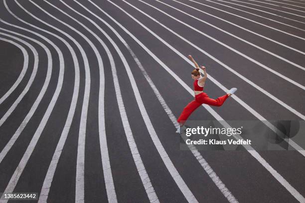 dancer practicing ballet dance on road - gambe divaricate foto e immagini stock