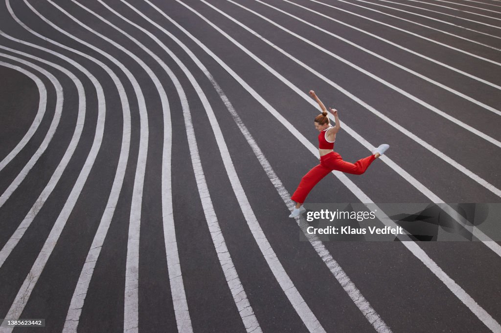 Dancer practicing ballet dance on road