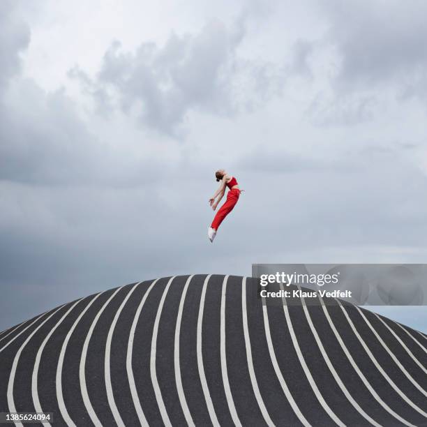 woman jumping while practicing ballet - person flying stock pictures, royalty-free photos & images