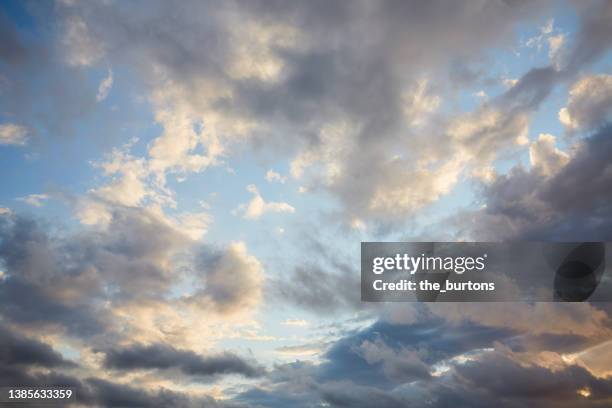 full frame shot of blue sky and dark clouds, abstract background - summer storm stock pictures, royalty-free photos & images