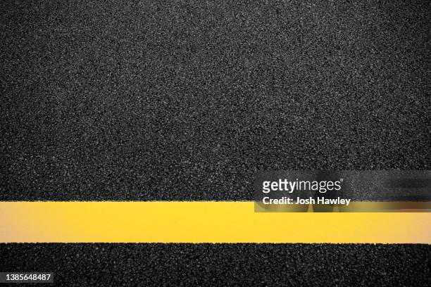 full frame shot of asphalt road - dubbla gula linjer bildbanksfoton och bilder