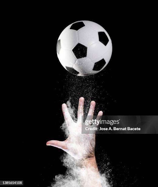 hand of a soccer player catching a ball. - ballon rebond stock pictures, royalty-free photos & images