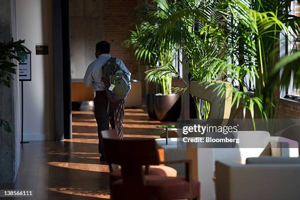 Student walks down a hallway at the new University of Pennsylvania's Wharton School in San Francisco, California, U.S., on Friday, Feb. 3, 2012. The...