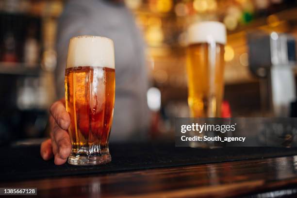 fresh beer - pint glass stock pictures, royalty-free photos & images