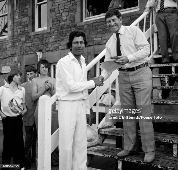 Gloucestershire batsman Zaheer Abbas receives the Man of the Match award from the adjudicator, Ken Barrington, after scoring 128 runs in the Gillette...