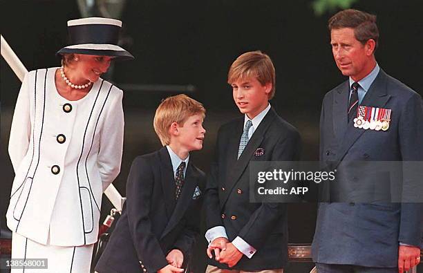 Princess Diana, her sons Harry and William, and Prince Charles watch the parade march past as part of the commemorations of VJ Day 19 August in...