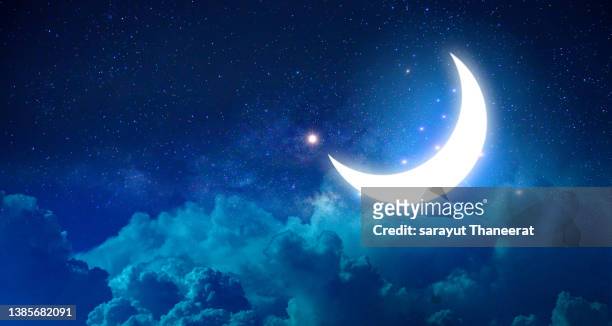 ramadan kareem the moon in the at night among the stars - eid sky stock pictures, royalty-free photos & images