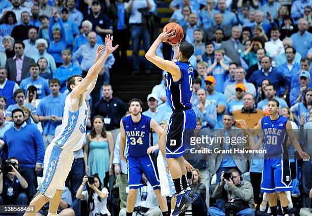 Austin Rivers of the Duke Blue Devils launches his last-second, game-winning 3-point basket over Tyler Zeller of the North Carolina Tar Heels at the...