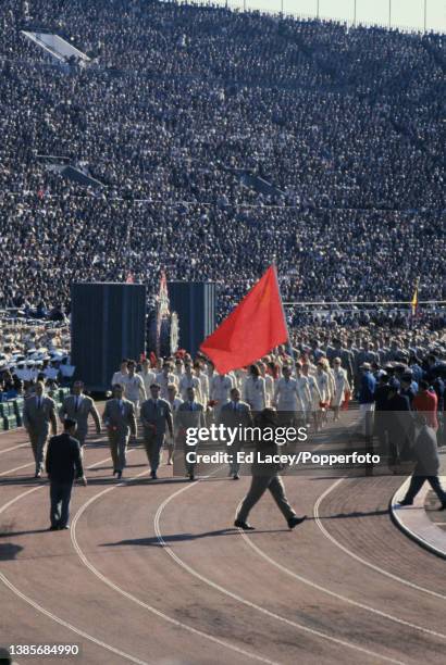 Athletes from the Soviet Union Olympic team take part in the Parade of Nations section of the opening ceremony for the 1964 Summer Olympics inside...