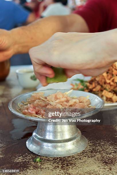 raw fish slices for yee sang - prosperity toss stock pictures, royalty-free photos & images