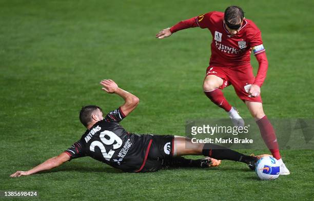 Craig Goodwin of Adelaide United sidesteps a Terry Antonis of the Wanderers tackle during the A-League Mens match between Adelaide United and Western...