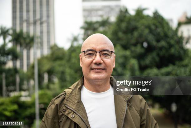 portrait of a mature man outdoors - completely bald stock pictures, royalty-free photos & images