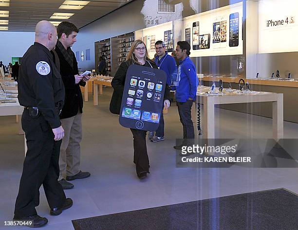 Amanda Kloer, Director of Organizing at Campaign on Change.org, leaves the Apple store during a protest in front of the Apple store in Washington, DC...