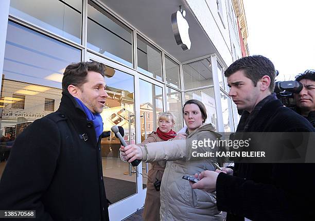 Mark Shields, who launched the Campaign on Change.org, speaks to reporters during a protest in front of the Apple store in Washington, DC on February...