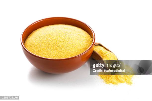 bowl with corn grits isolated on white background - cornmeal stock pictures, royalty-free photos & images