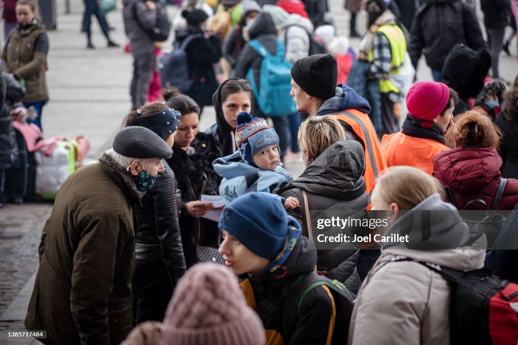 Ukrainians outside the train station in Lviv, Ukraine