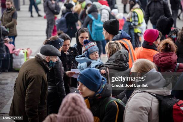 ukrainians outside the train station in lviv, ukraine - emigration and immigration stock pictures, royalty-free photos & images