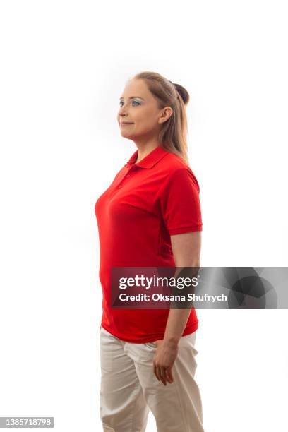 side view of woman in red t-shirt polo - polo shirt stock pictures, royalty-free photos & images