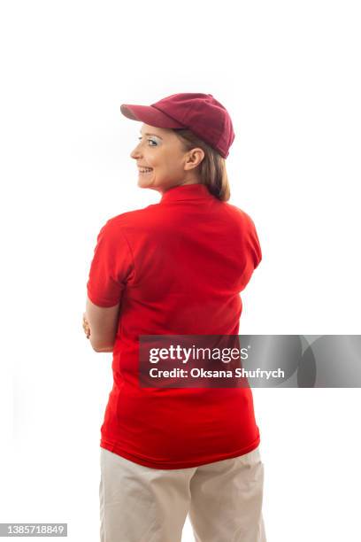 back view of woman in red t-shirt polo - red polo stock pictures, royalty-free photos & images