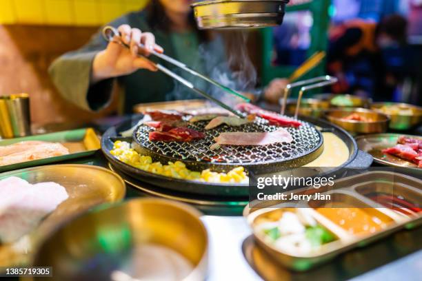 korean dinner and hand unfocus - north korea daily life stock pictures, royalty-free photos & images
