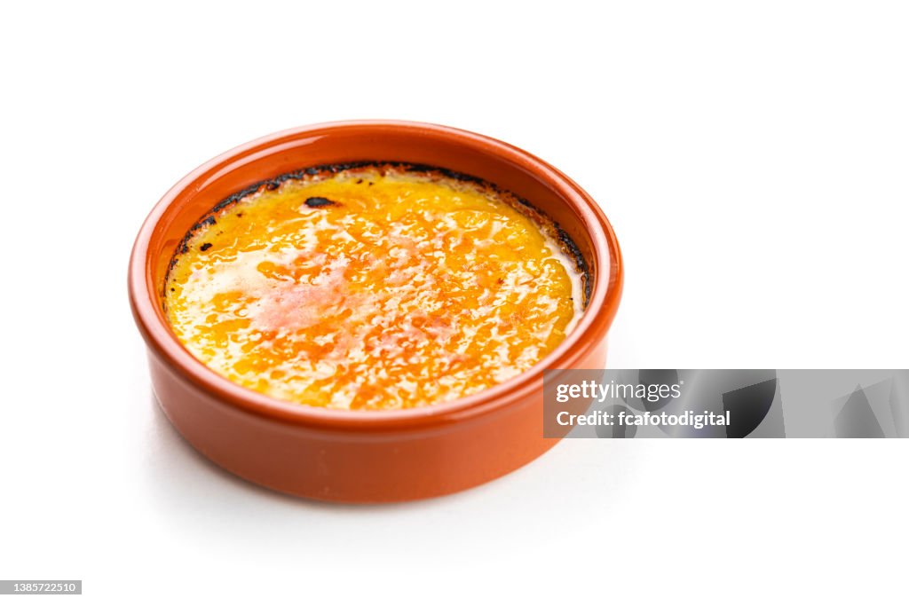 Sweet food: Creme brulee or Crema Catalana isolated on white