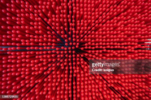 dense red plastic rods - polimero foto e immagini stock