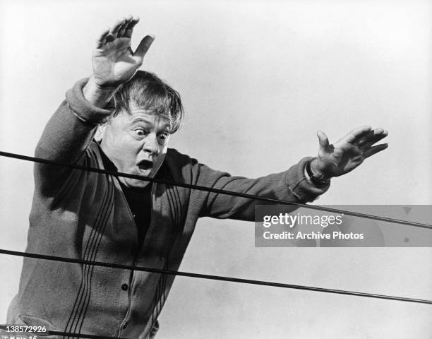 Mickey Rooney reaching for ropes in a scene from the film 'It's A Mad Mad Mad Mad World', 1963.