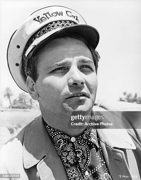 Peter Falk wearing yellow cab hat in a scene from the film 'It's A Mad Mad Mad Mad World', 1963.