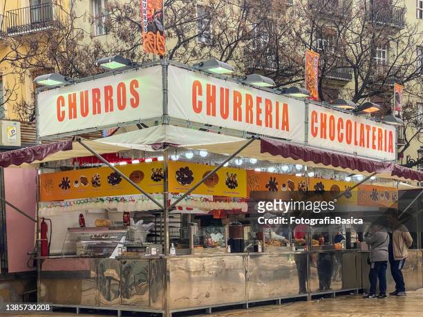 street food stand selling churros - churro stockfoto's en -beelden